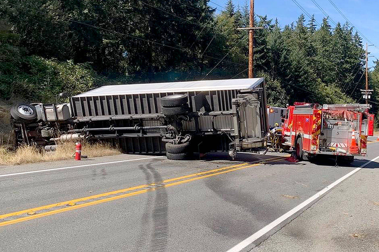 Driver loses control, tips his truck