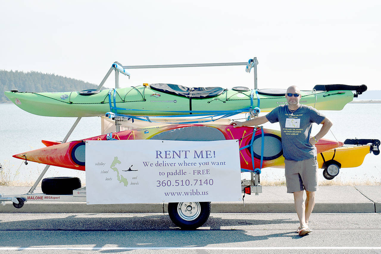 Steve Adams operates a mobile kayak and stand-up paddleboard business and often parks his trailer on Pioneer Way. Photo by Emily Gilbert/Whidbey News-Times.