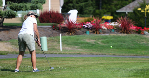 Anna Anderson chips to the green in the Ladies’ Short and Sweet Par-3 Challenge Thursday, Sept. 10, at the Whidbey Golf Club. (Photo by John Fisken)