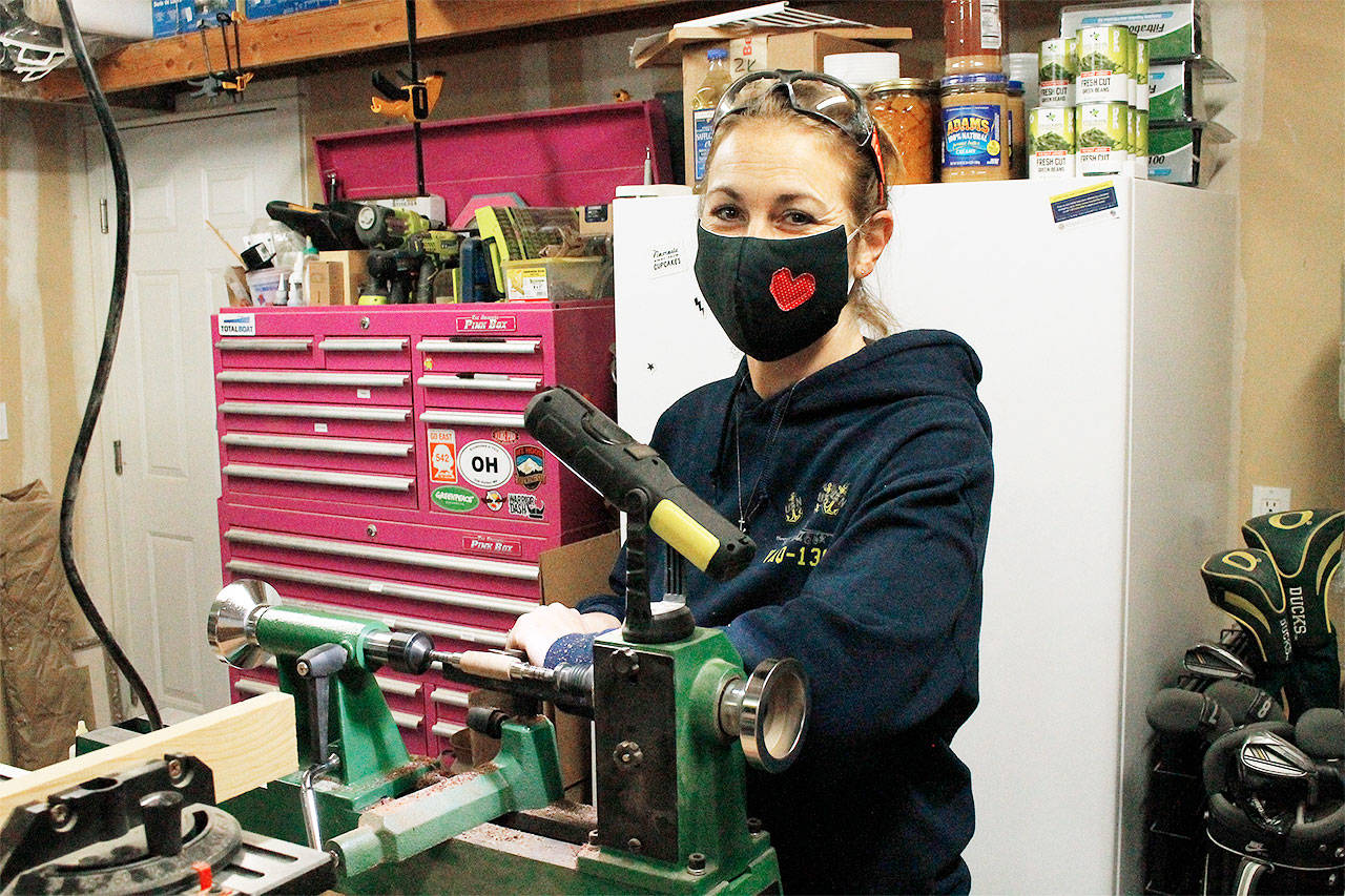Amber Hawkins, founder of Whidbey Wood Girl, turns a wooden razor handle at the lathe. Hawkin’s wares will be available at the Bayview Farmers Market Holiday Pop-up event on Saturday. Her products are also available at the 3 Sisters Market in Coupeville and the PNW Vibes Market in Oak Harbor. Photo by Kira Erickson/South Whidbey Record