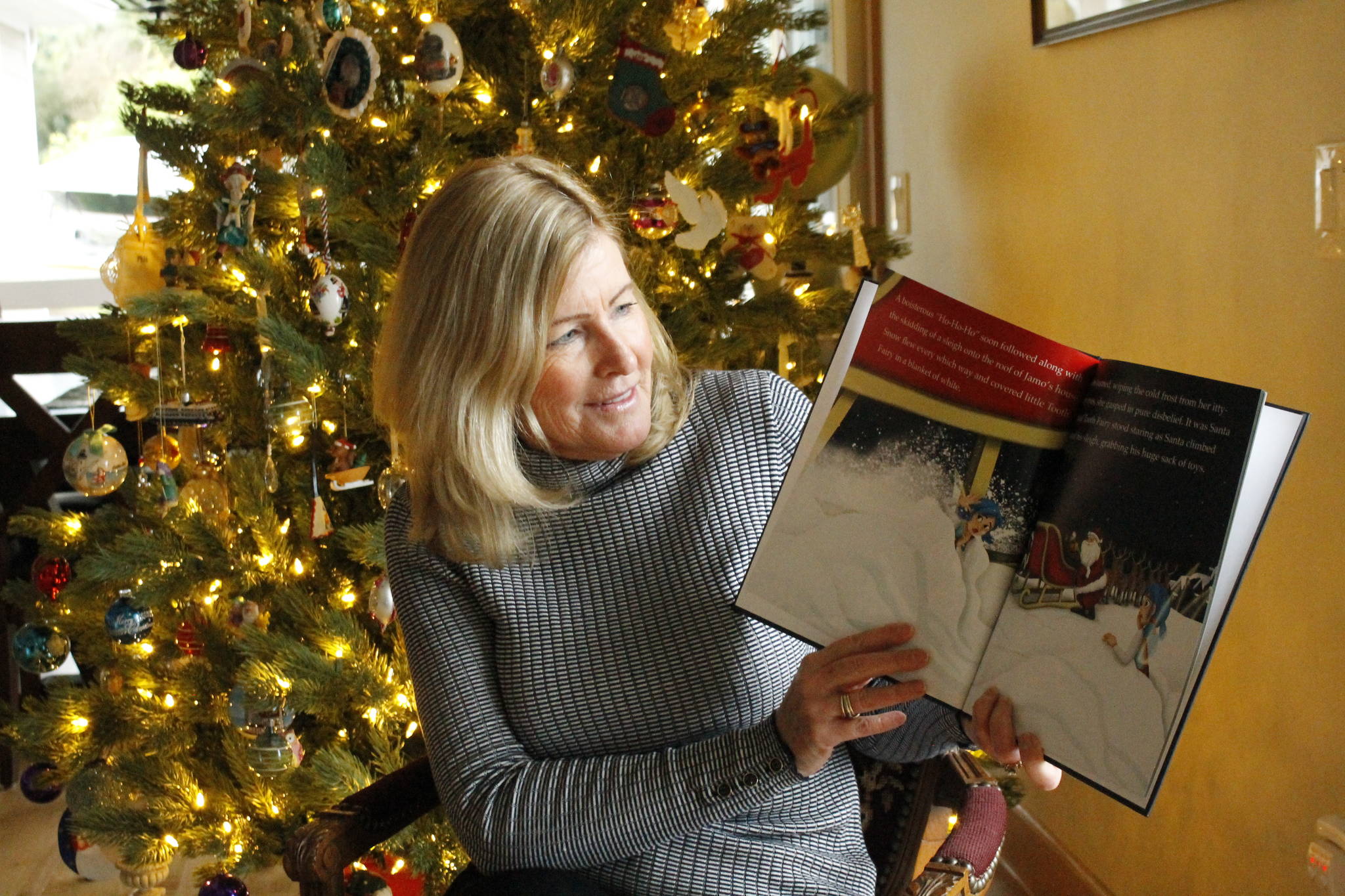 Langley author Barb DeMartino’s Christmas-themed children’s book was recently published, just in time for the holidays. “Tooth Fairy’s Jolly Adventure” was inspired by DeMartino’s six-year-old grandson, who lost a tooth on Christmas Eve last year. Photo by Kira Erickson/South Whidbey Record