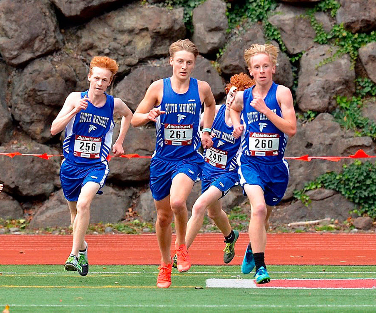 This year’s Falcon cross country team includes a strong group of seniors, including Reilly McVay, left, Cooper Ullmann, Aidan Donnelly and Thomas Simms, shown here competing in a meet in 2019. (Photo by Karen Swegler)