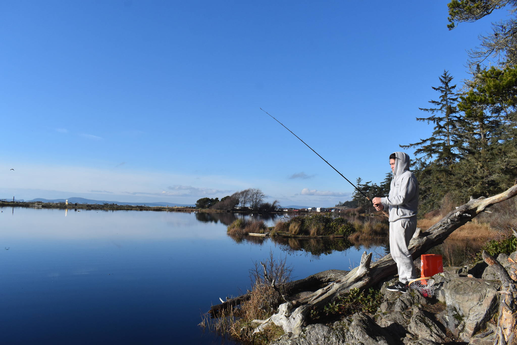 Aiden Santos of Anacortes went fishing at Cranberry Lake in Deception Pass State Park last Saturday. The state park would be used as a Navy training site along with 27 others under a new 5-year proposal.