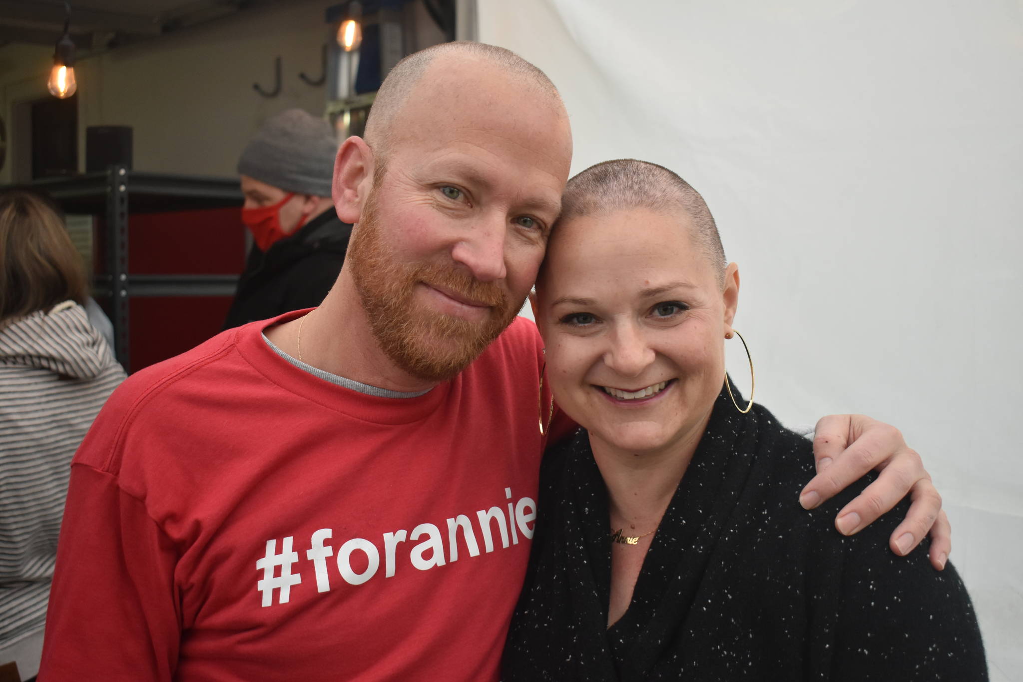 Jason McFadyen, left, organized about a dozen friends to shave their heads in support of Annie Cash as she goes through breast cancer treatment. Cash was voted top real estate agent, business person and community leader in the Whidbey News-Times’ Best of Whidbey 2020 contest. Photos by Emily Gilbert/Whidbey News-Times