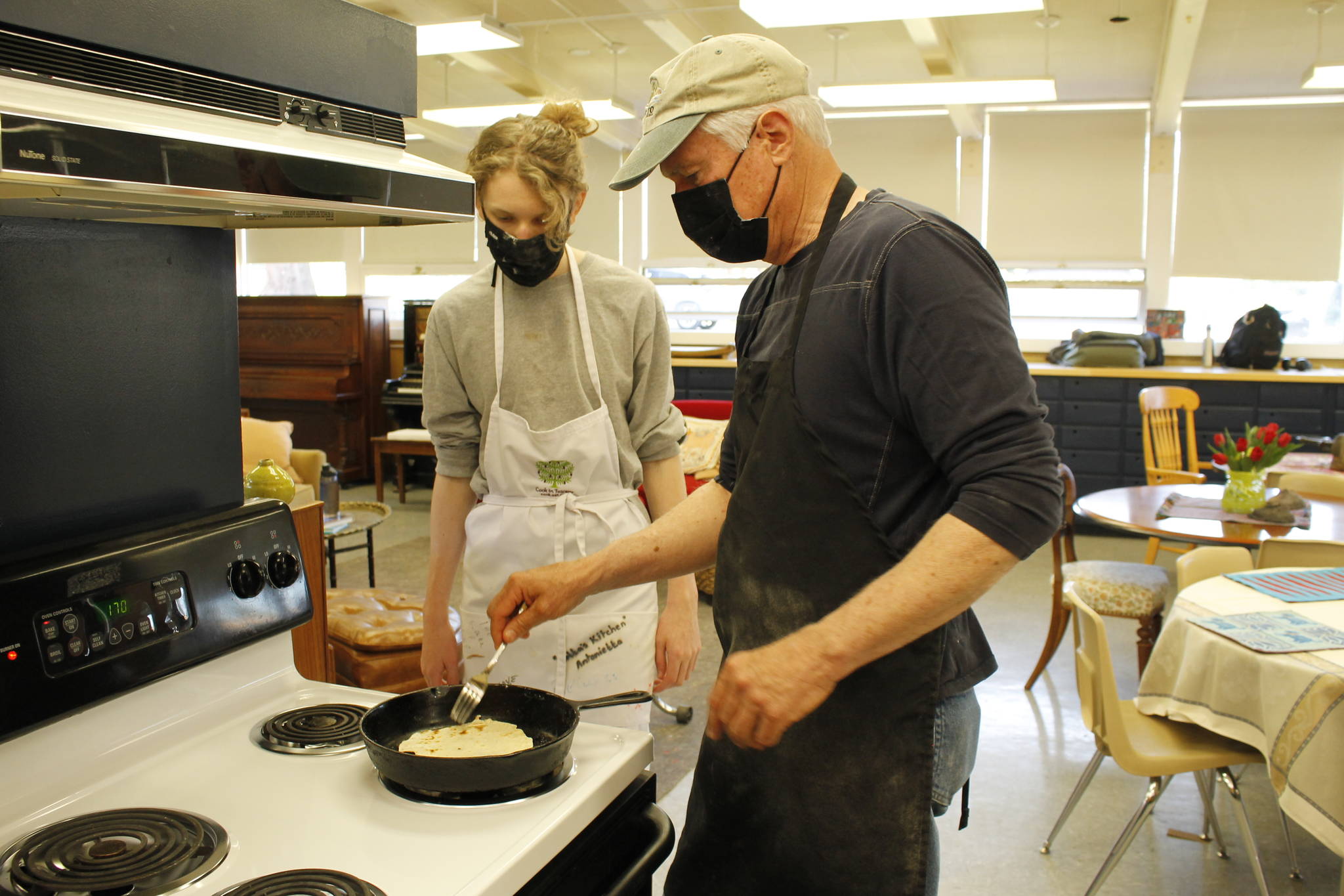 Joe Whisenand, right, shows freshman Spencer Jonas how to make a tortilla in the Learning Lab at Langley. (Photo by Kira Erickson/South Whidbey Record)