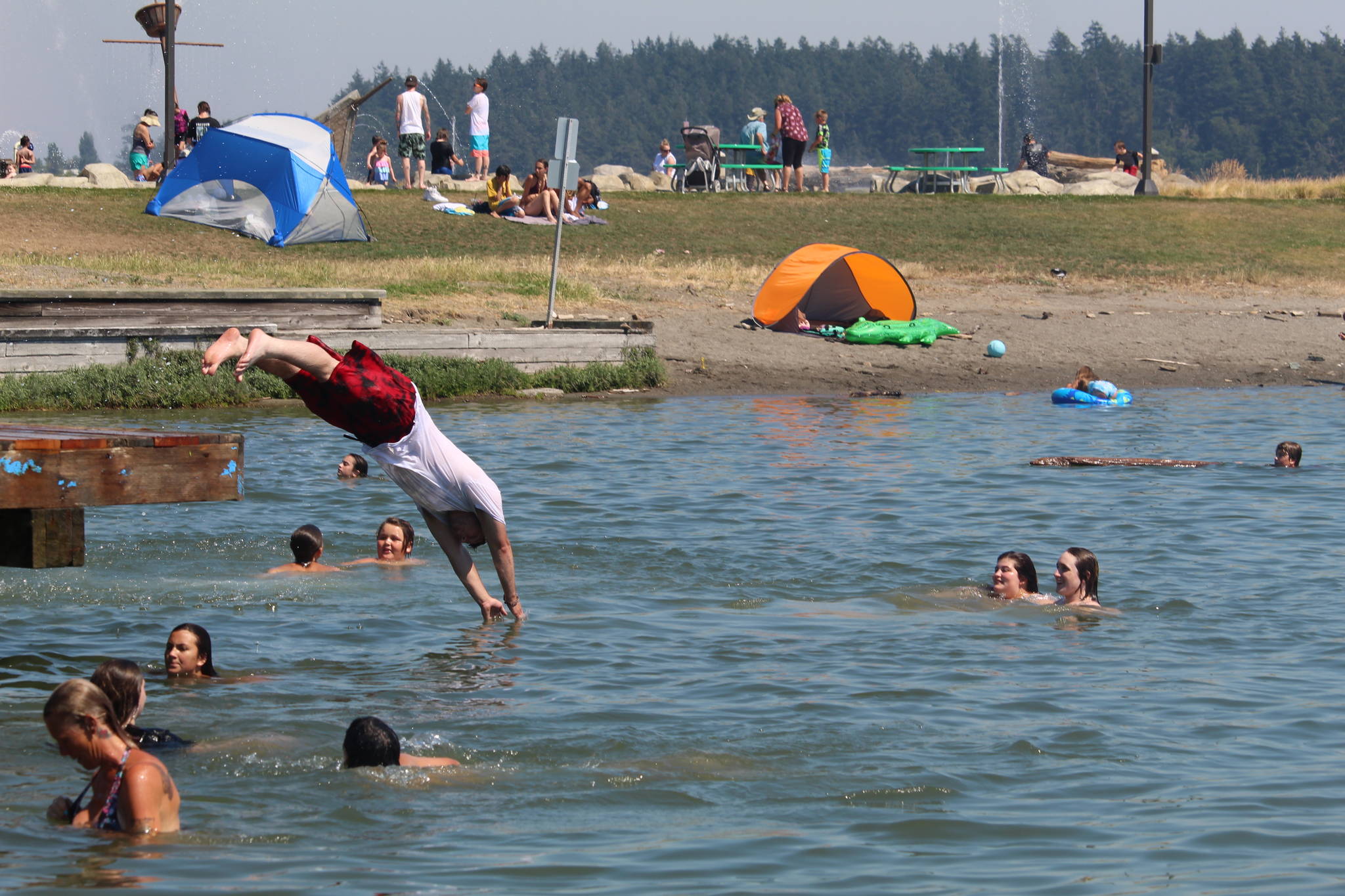 The lagoon and the splash pad at Windjammer Park were popular as residents tried to beat the heat. (Photo by Karina Andrew/Whidbey News-Times)