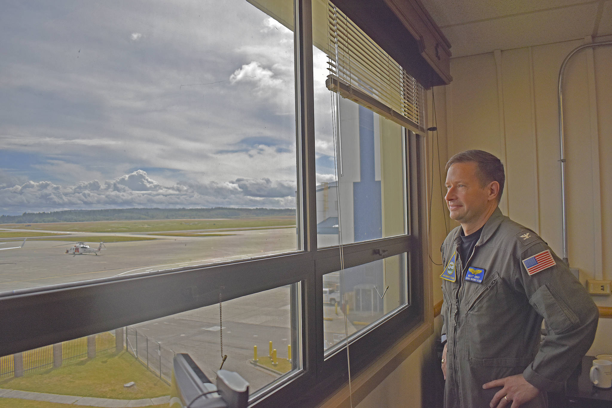 Naval Air Station Whidbey Island Commander Capt. Matthew Arny overlooks the flight line at Ault Field. Photo by Emily Gilbert/Whidbey News-Times
