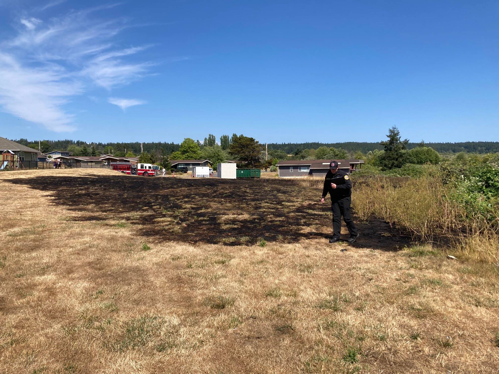 U.S. Navy photo
Fire Inspector Zach Walker looks at the damage of a small fire at a yard in military housing in Crescent Harbor Tuesday. Island County entered a Type II burn ban Thursday afternoon until further notice.
Navy photo
Naval Air Station Whidbey Island Fire Inspector Zach Walker looks at the damage of a small fire near a yard in military housing in Crescent Harbor on Tuesday.