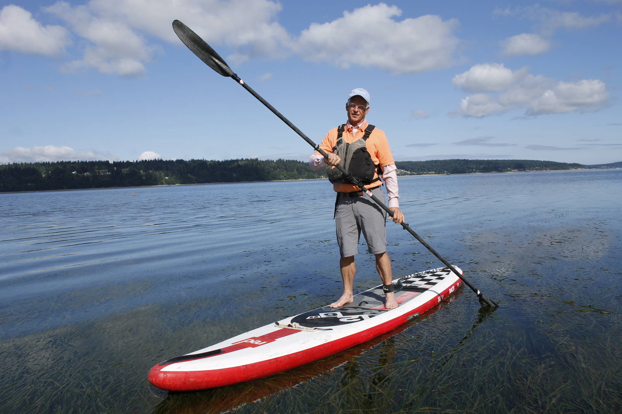 Freeland resident Kevin Lungren has been commuting to the office using his paddleboard. It’s a commute he can do in all seasons and just about any type of weather, except wind. (Photo by Kira Erickson/South Whidbey Record)