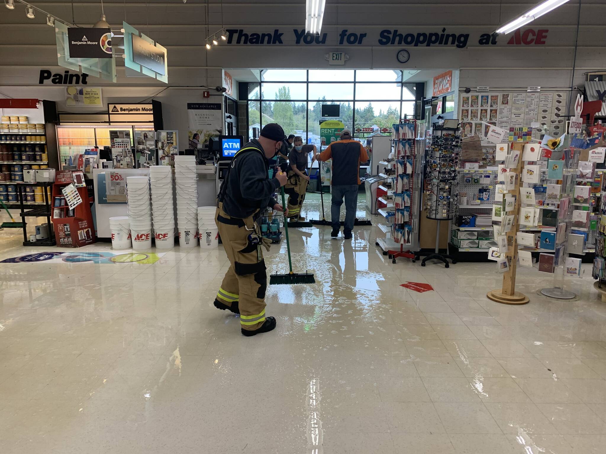 Crew members from South Whidbey Fire/EMS responded to a flood Tuesday afternoon in Ace Hardware caused by a broken pipe. (Photo provided)