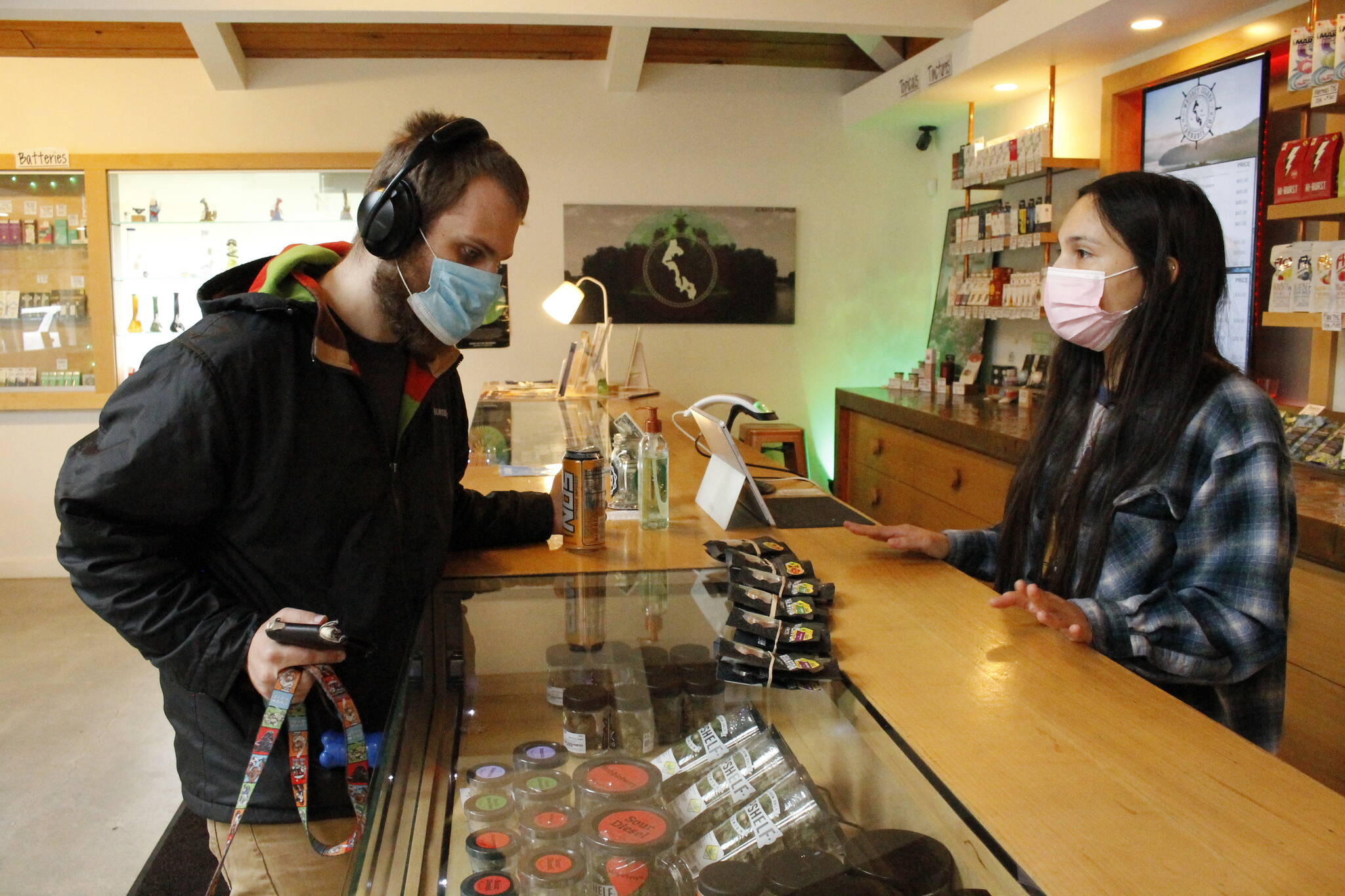 Photo by Kira Erickson/South Whidbey Record
Budtender Kati Sinclair helps customer Ryan Morgan with a purchase at Whidbey Island Cannabis Company.