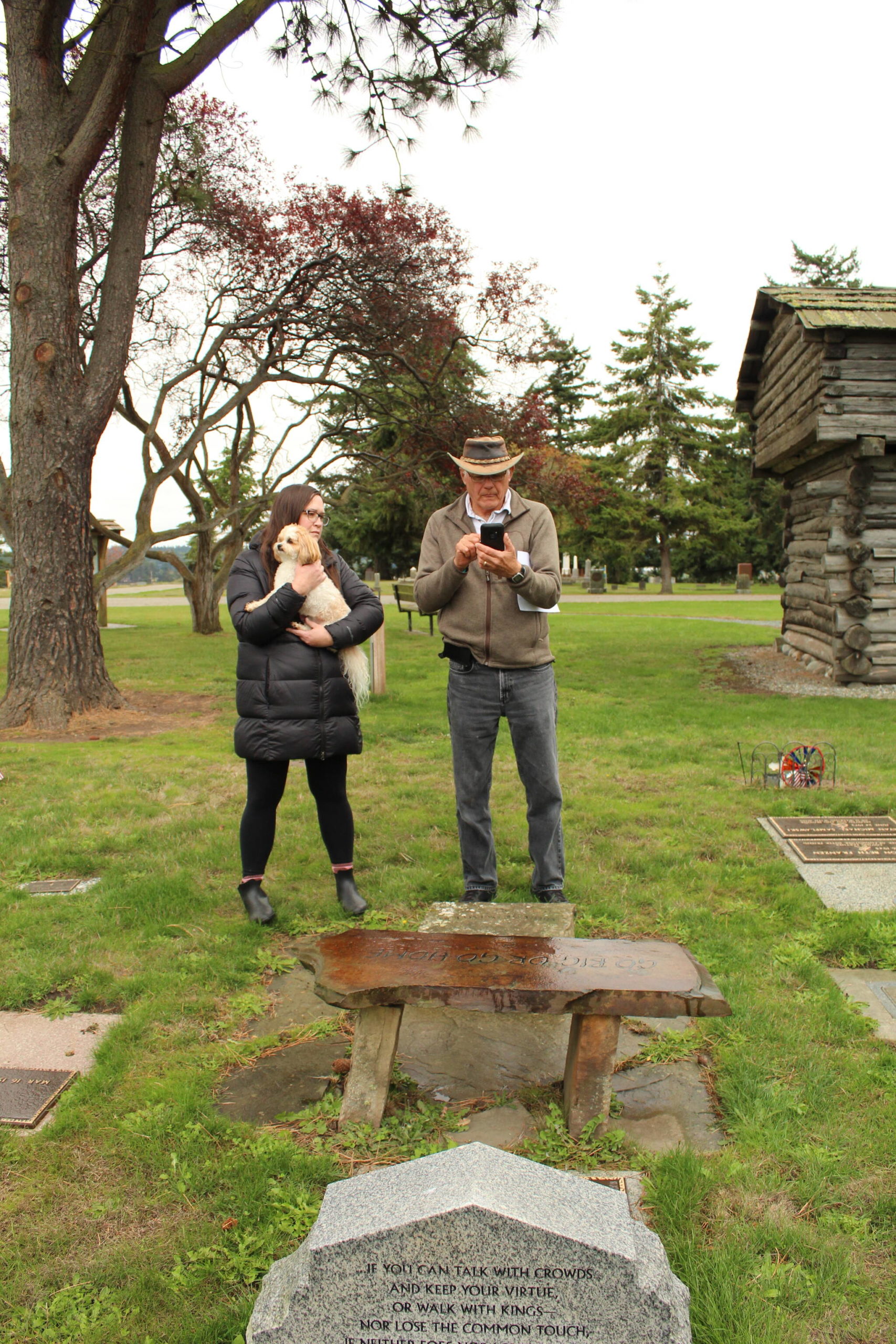 Photo by Karina Andrew/Whidbey News-Times
Laura Foley, left, and Don Meehan find a grave in Sunnyside Cemetery using a GPS locator.