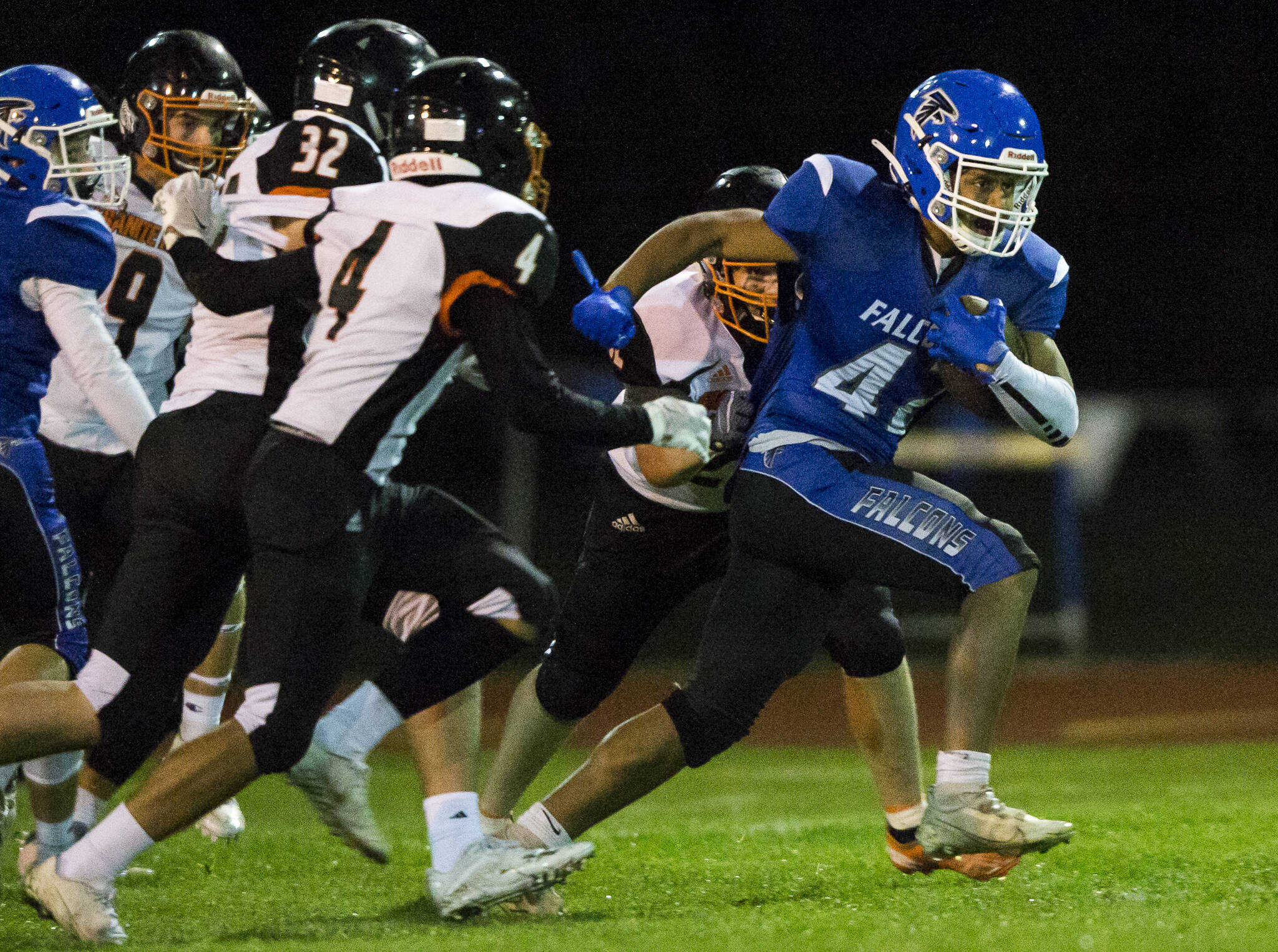 South Whidbey's Cole Tschetter escapes multiple tackles during the game against Granite Falls on Friday, Oct. 29, 2021 in Langley, Wa. (Olivia Vanni / The Herald)