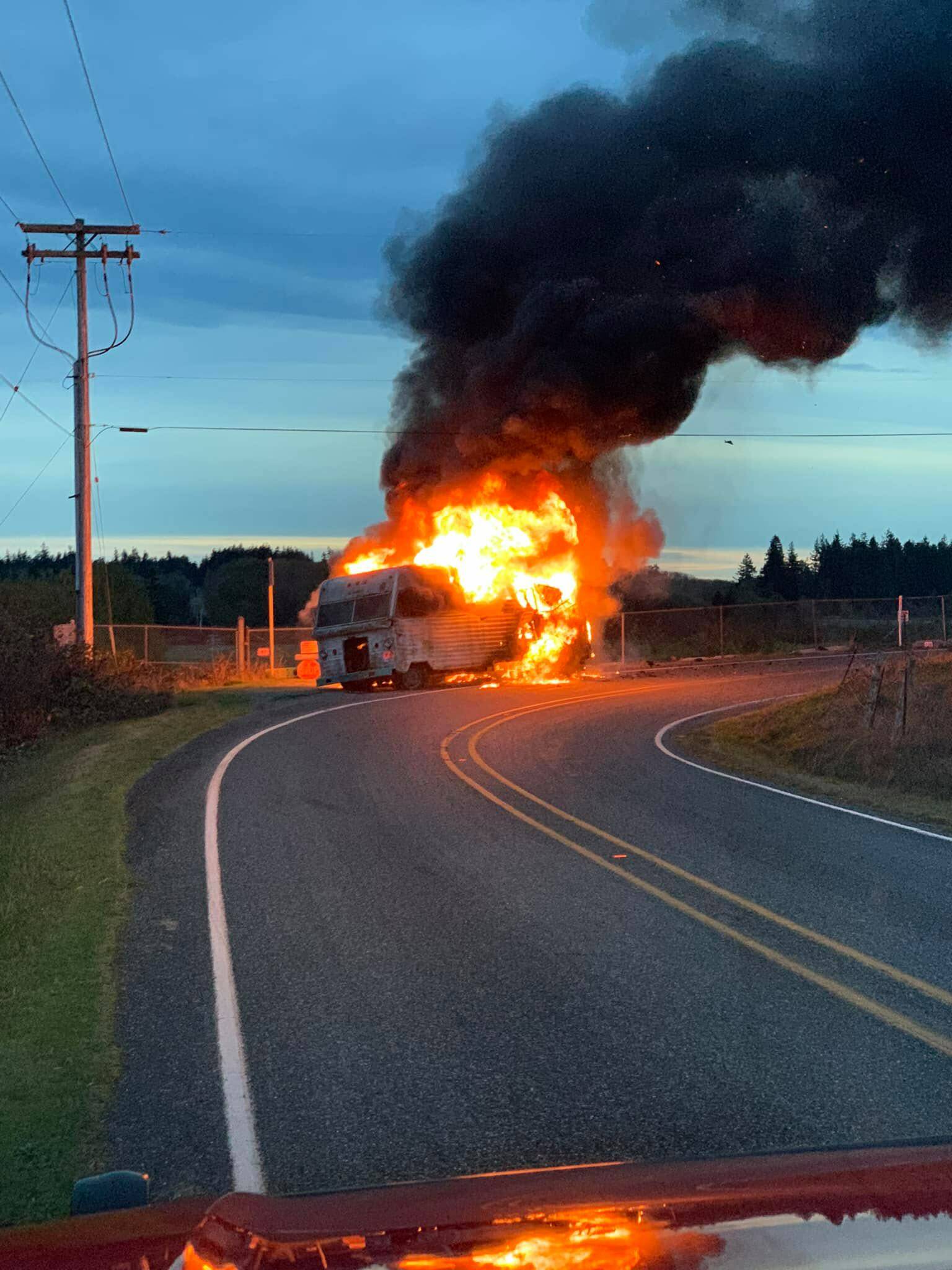 An RV caught fire Monday after being dragged along the road on its wheel rims, North Whidbey Fire and Rescue reports. (Photo provided)