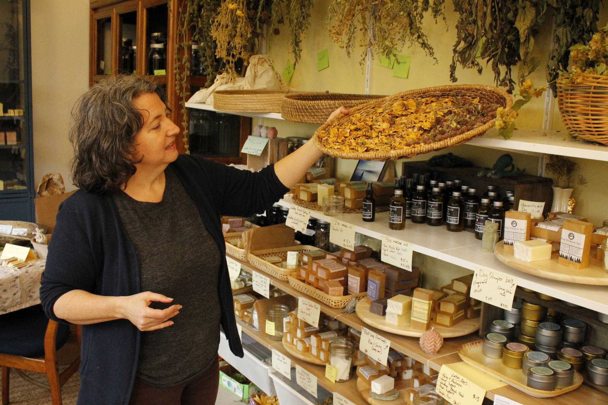 Photos by Kira Erickson/South Whidbey Record
Herbalist Lori Kane arranges a display in her studio.