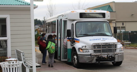 Photo by Karina Andrew / Whidbey News Group
Riders board an Island Transit bus at the transit station in Oak Harbor.