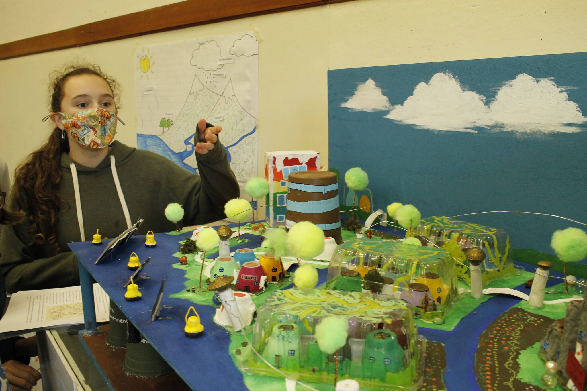 Photo by Kira Erickson/South Whidbey Record
Eighth grader Alicia Jenkins displays the model of Siyá:m, the fictional futuristic city middle school students designed.