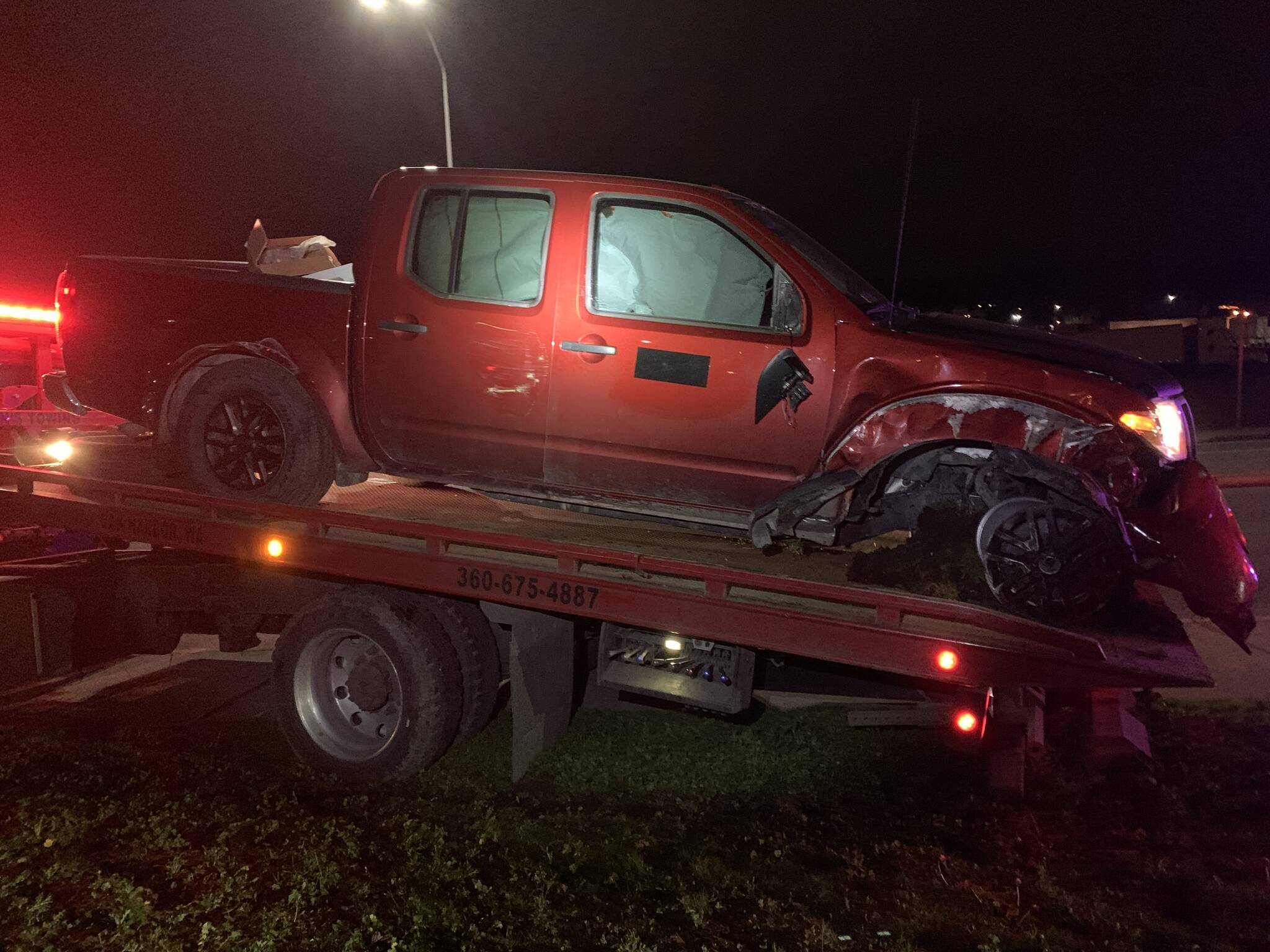 Oak Harbor Police photo A pickup involved in a high-speed chase in Oak Harbor Sunday night was damaged when the suspect crashed into a tree.
