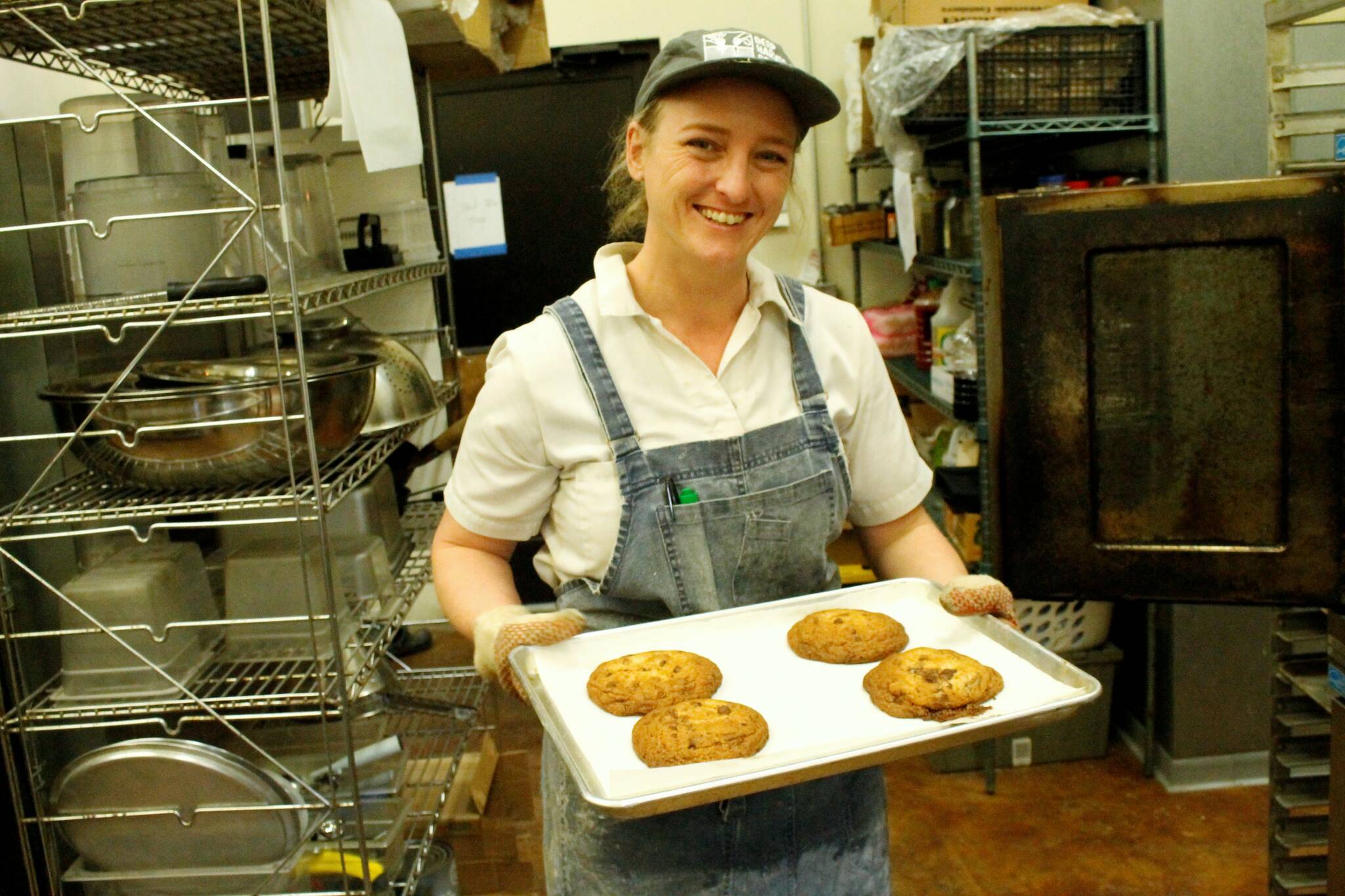Photo by Kira Erickson/South Whidbey Record
Baker Camille Green holds a tray of chocolate-chip cookies fresh from the oven.