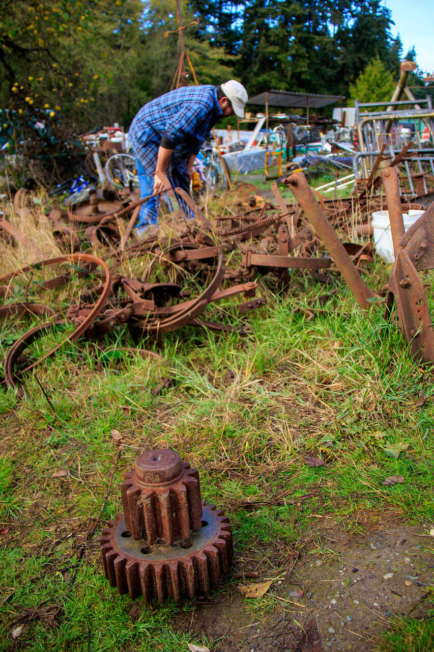Photo by Dave Welton
A customer sorts through scrap metal at Island Recycling. Artists and fabricators enjoy scoping out the wares on a regular basis.