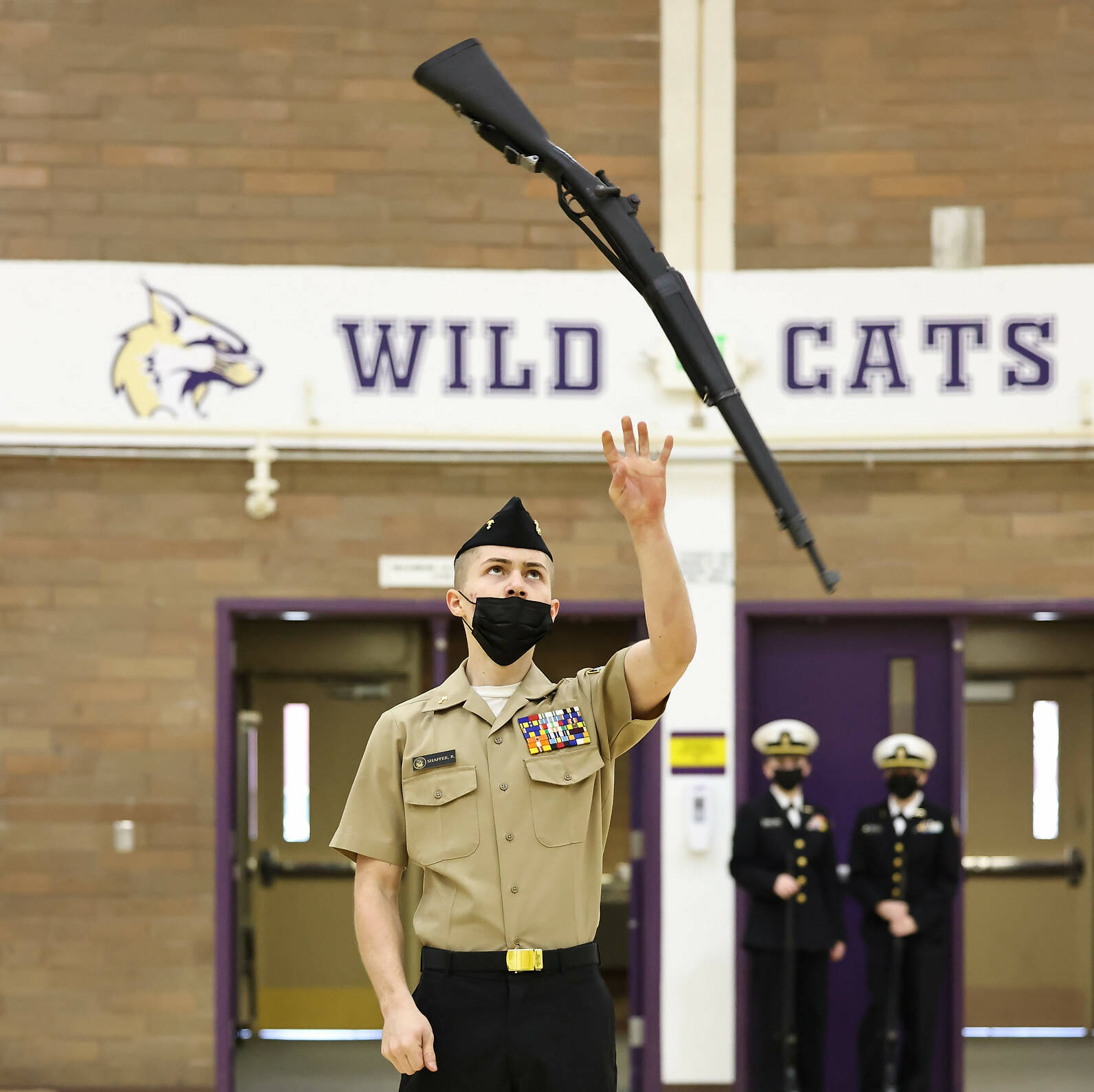 Oak Harbor junior Ryan Shaffer participates in the armed individual exhibition during an NJROTC meet Feb. 12. (Photo by John Fisken)