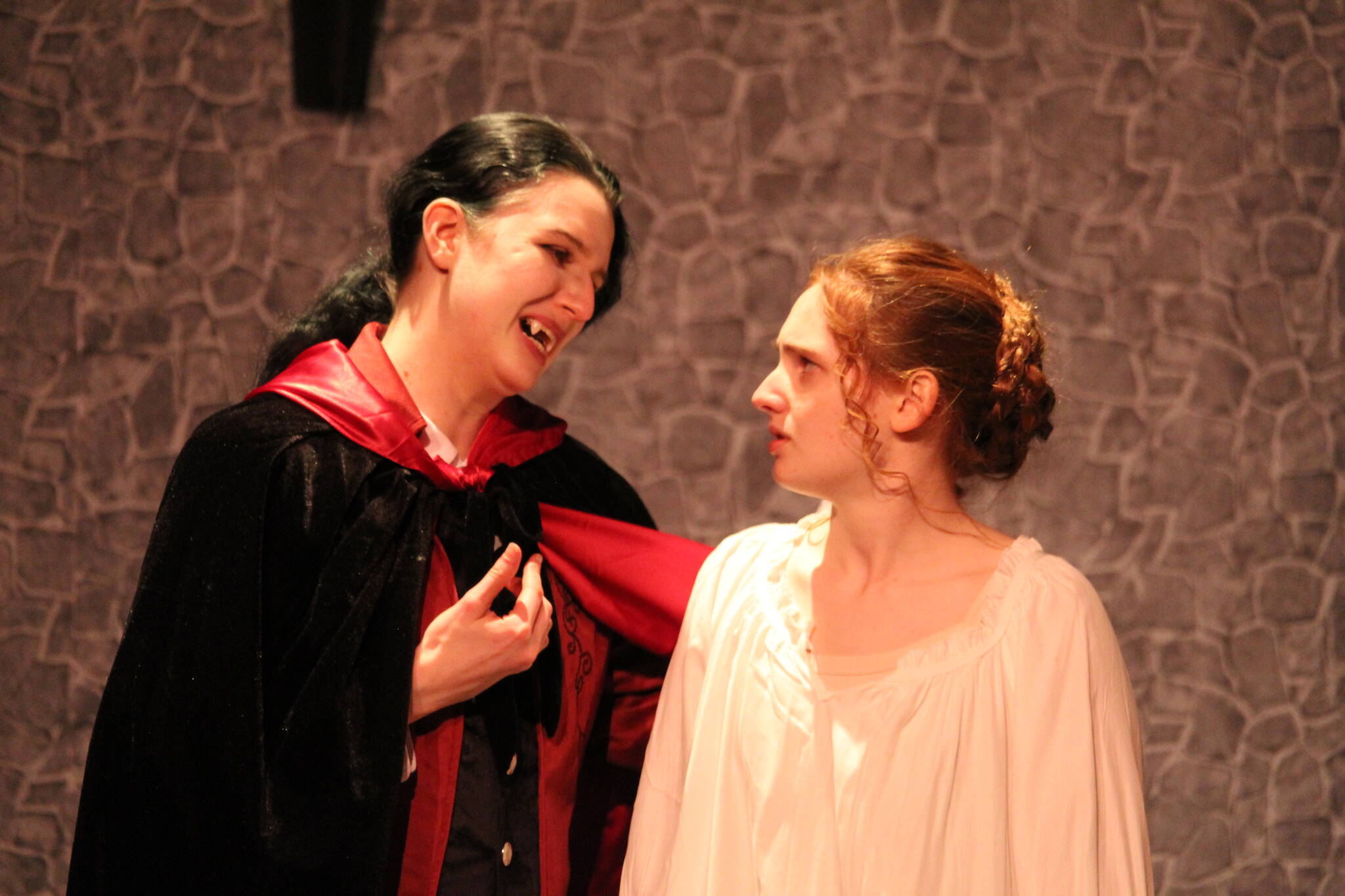 Zoe Eisenbrey, left, and Sadie Marriott, who play Count Dracula and Mina Murray Harker, rehearse a scene.