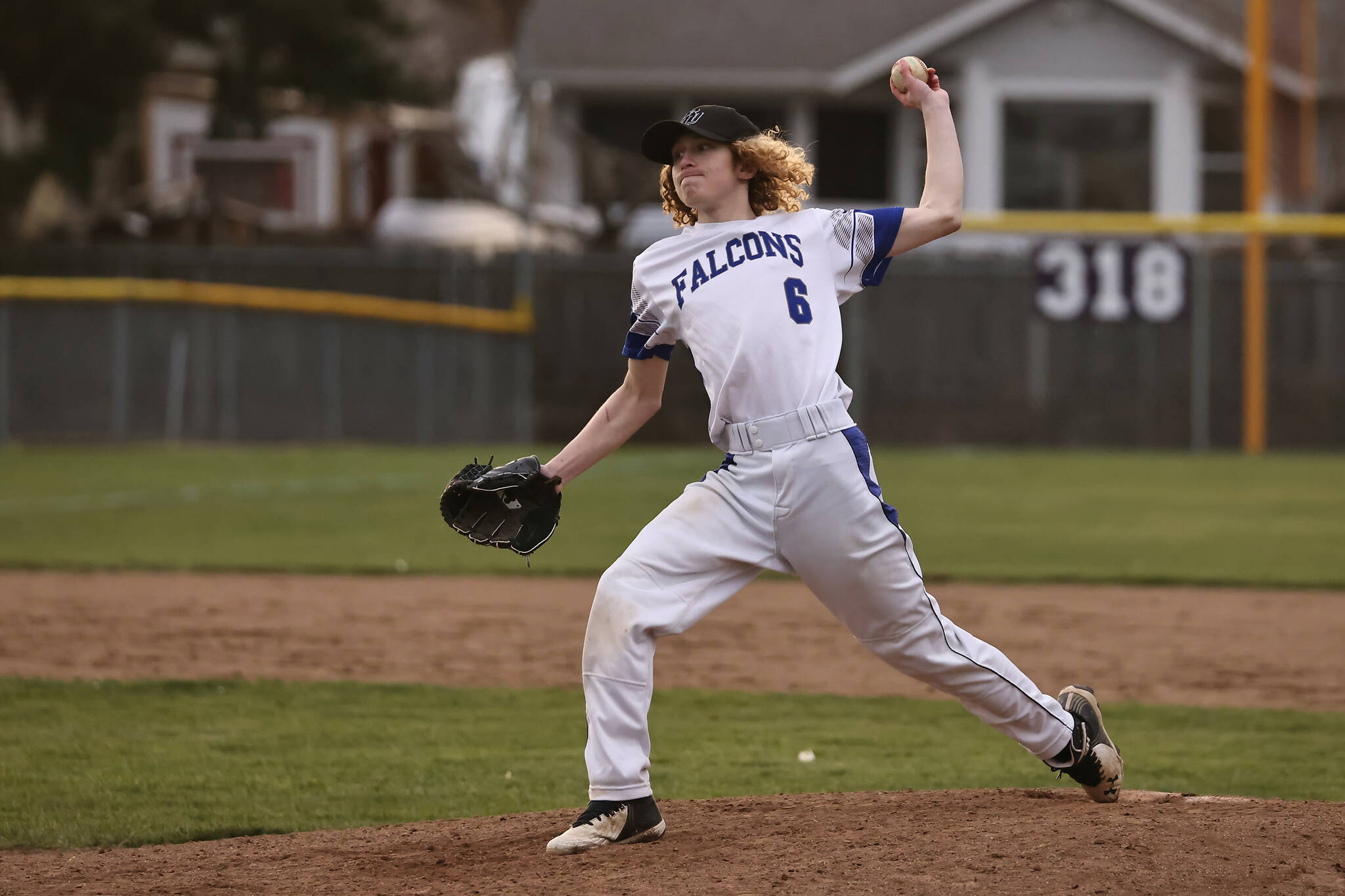 Junior Dylan Michalopoulos of South Whidbey winds up his throwing arm during an island-wide jamboree in Oak Harbor March 11. The event was the first of the season. The Falcons will be playing a double header on home turf this Saturday against Bellingham. (Photo by John Fisken)