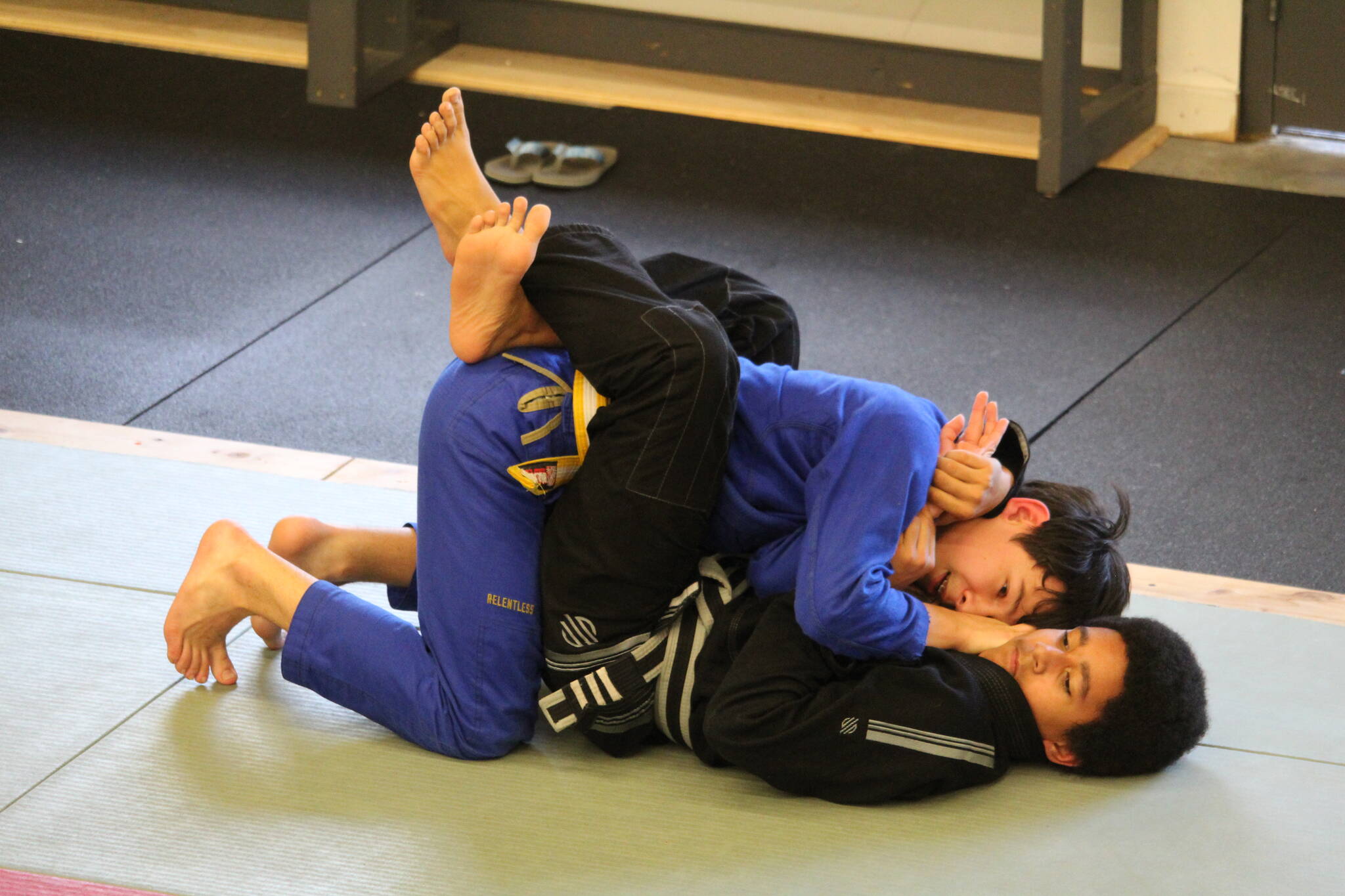 Photo by Karina Andrew/Whidbey News-Times
Austen Deater, left, practices with Devon Robinson in the teens’ Jiu Jitsu class.