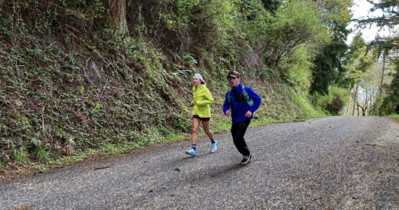 Riley Nachtrieb, left, runs the last mile of the Whidbey Island Traverse accompanied by Herman Meyer. (Photo provided)