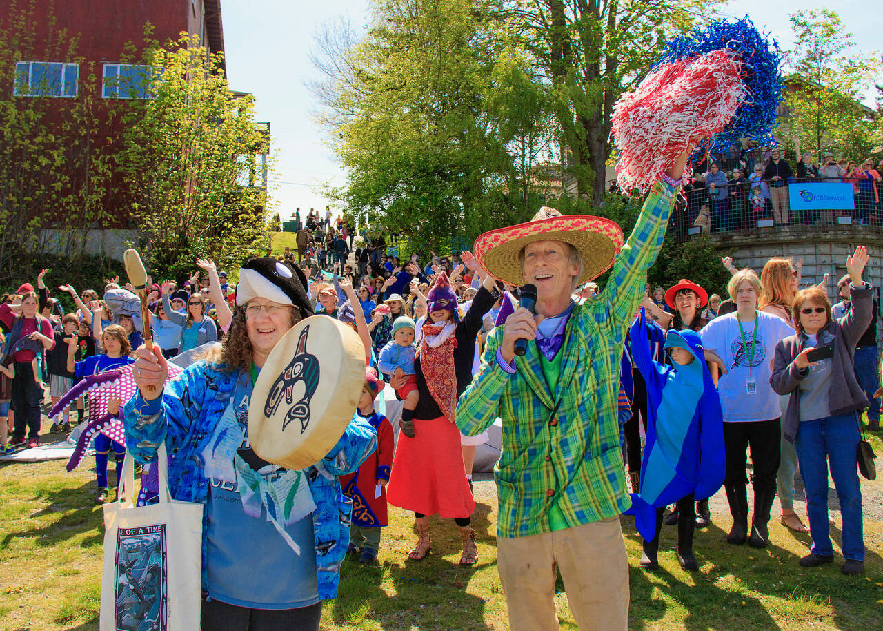 Photo by David Welton
Susan Berta, co-founder of the Orca Network, leads the parade during a previous year.