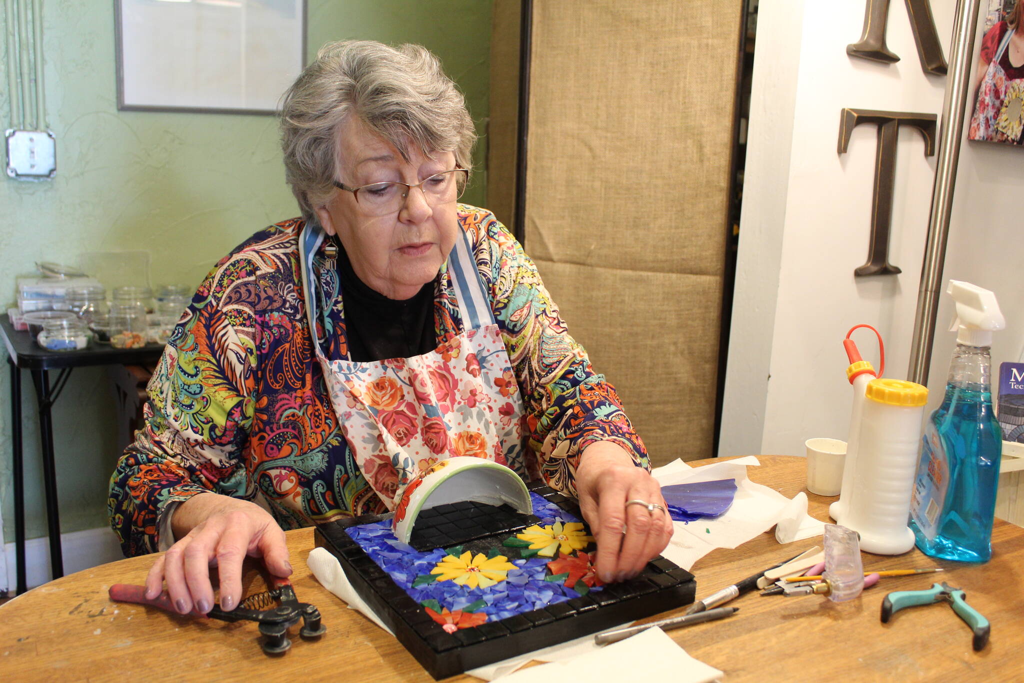 Charlotte Gray creates mosaic art in her studio in her Oak Harbor shop, Whimsies. (Photos by Karina Andrew/Whidbey News-Times)