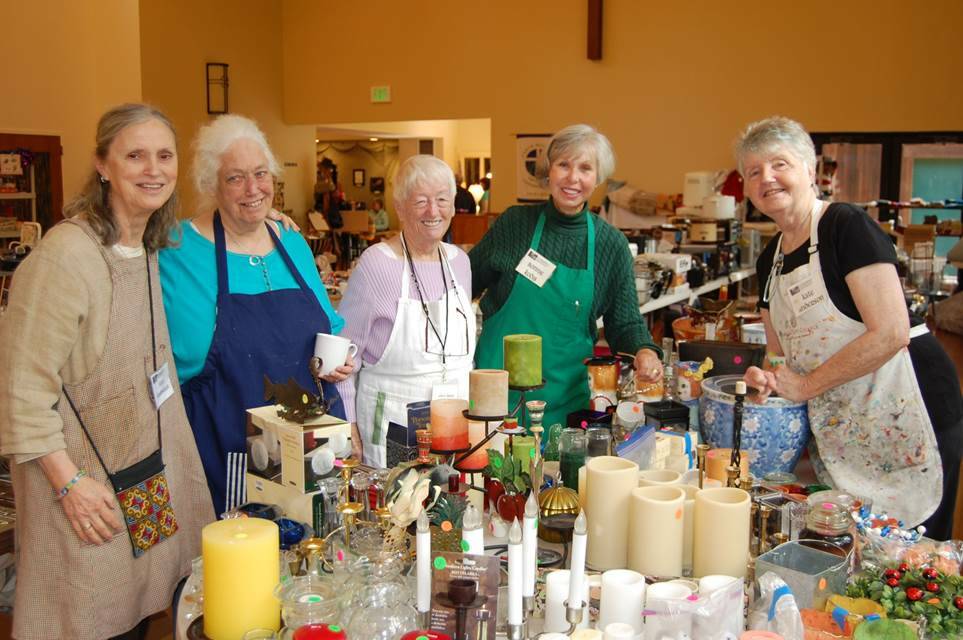 Photo provided
Volunteers at a previous sale gather around a table of housewares.