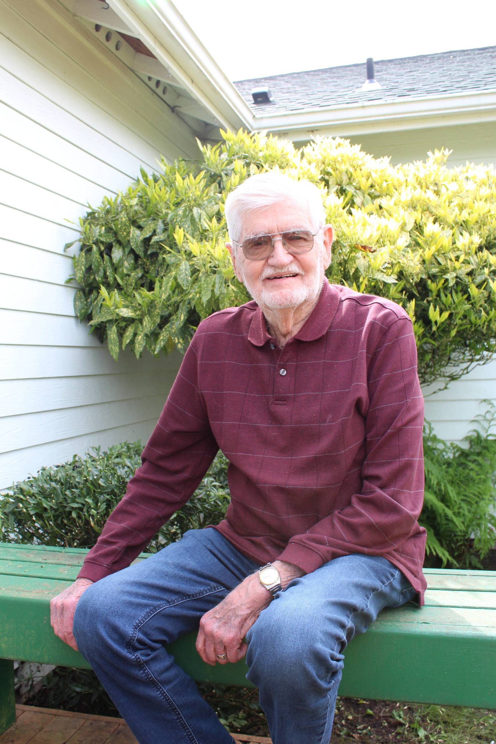Conrad Von Doran, a long-time avid gardener, enjoys the nice weather in his back yard near Holmes Harbor. (Photo by Karina Andrew/Whidbey News-Times)