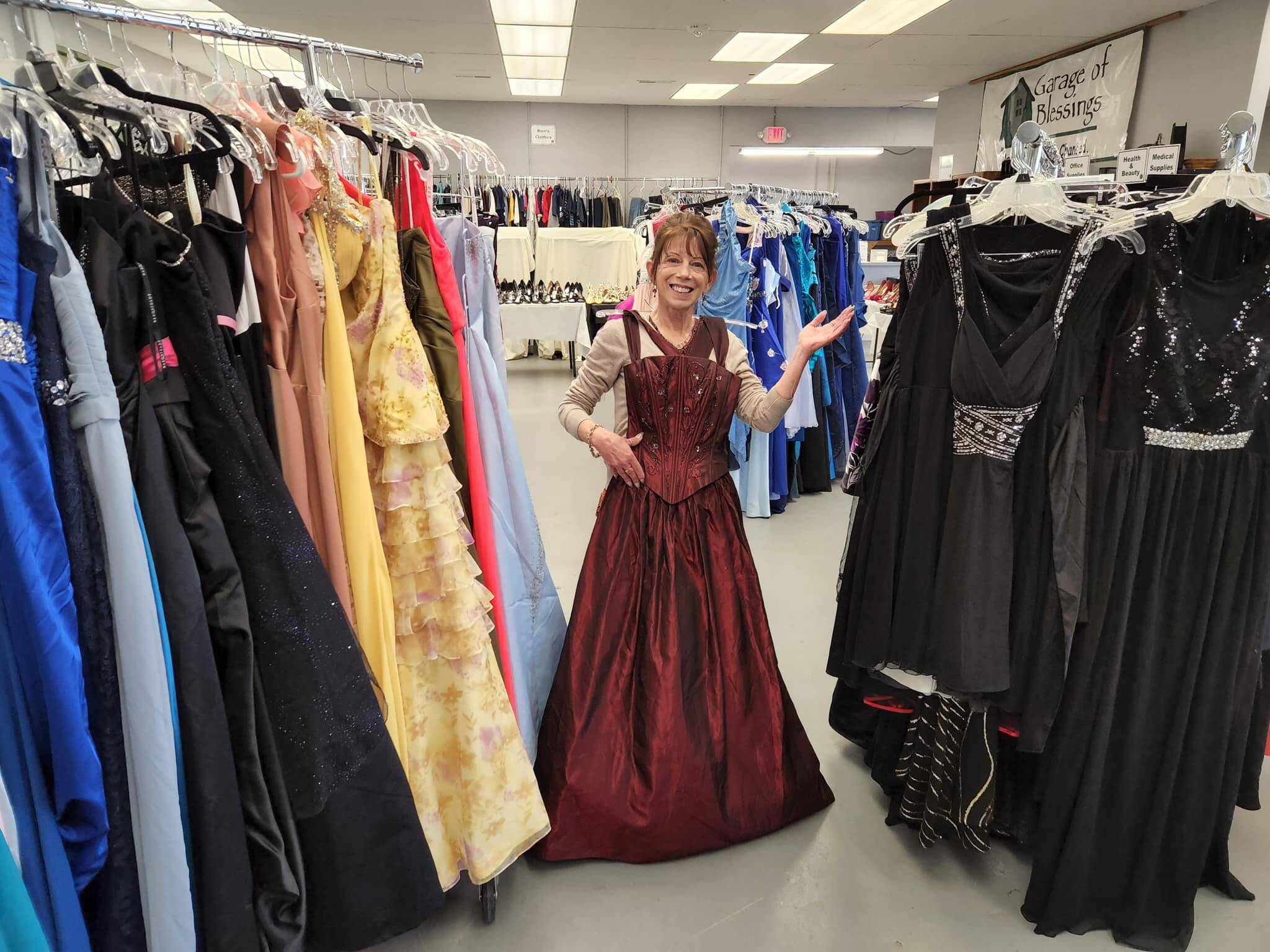 Patty Folkestad with prom dresses. (Garage of Blessings Facebook)