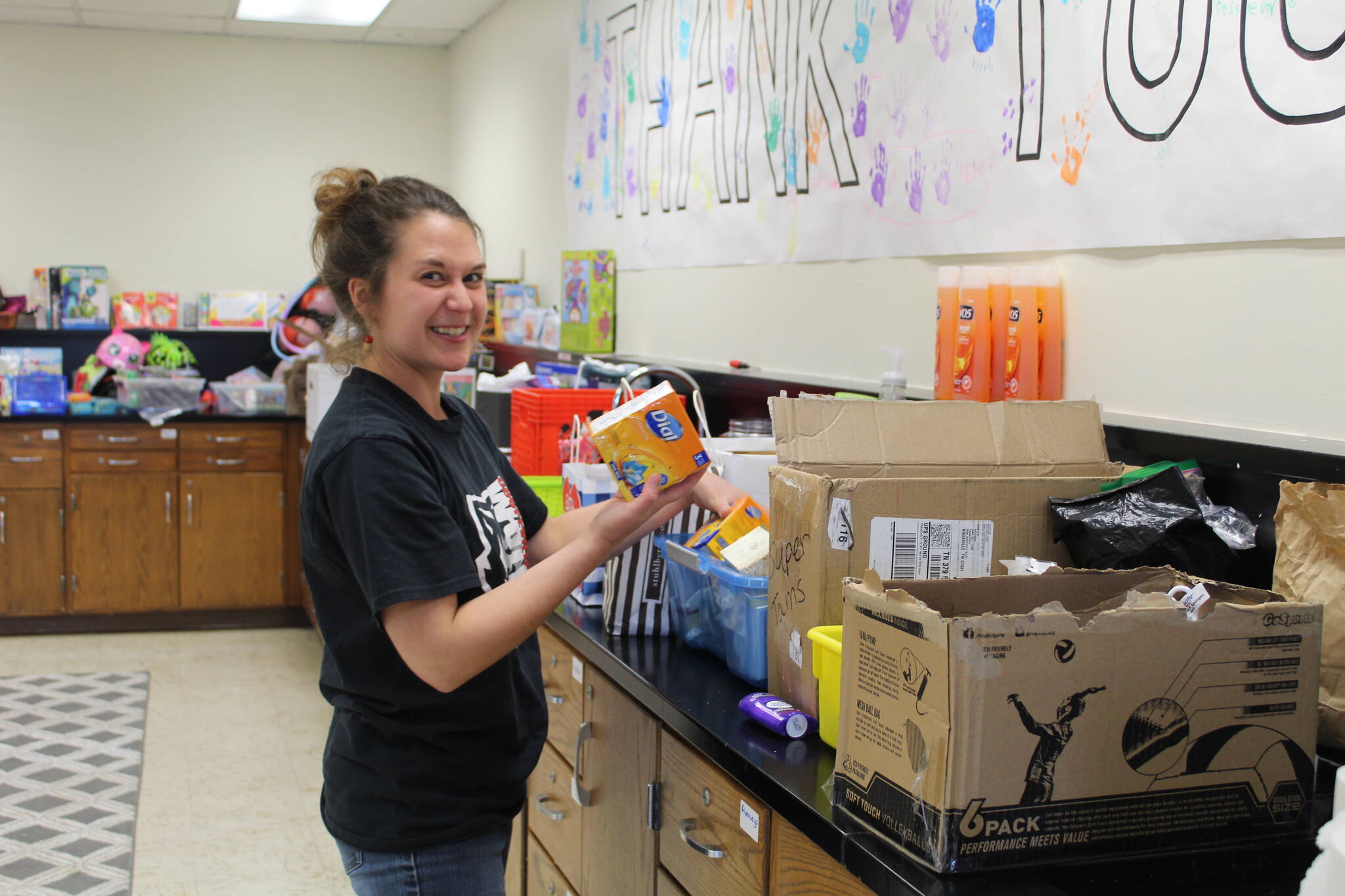 Photo by Karina Andrew/Whidbey News-Times
Arianna Bumgarner stocks soap and other hygiene products in Coupeville School Districts McKinney-Vento center.
