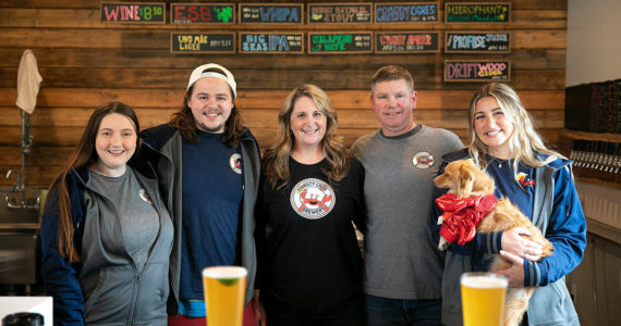 From left, Rachael Carrigan, Nate Hanson, Erin Hanson, Jeff Hanson and Kacie Hanson pose for a group photo at Thirsty Crab Brewing in Clinton. (Ryan Berry / The Herald)