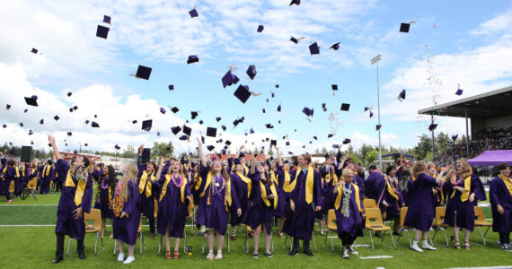 Photo by John Fisken Oak Harbor High School students celebrate graduation the traditional way.