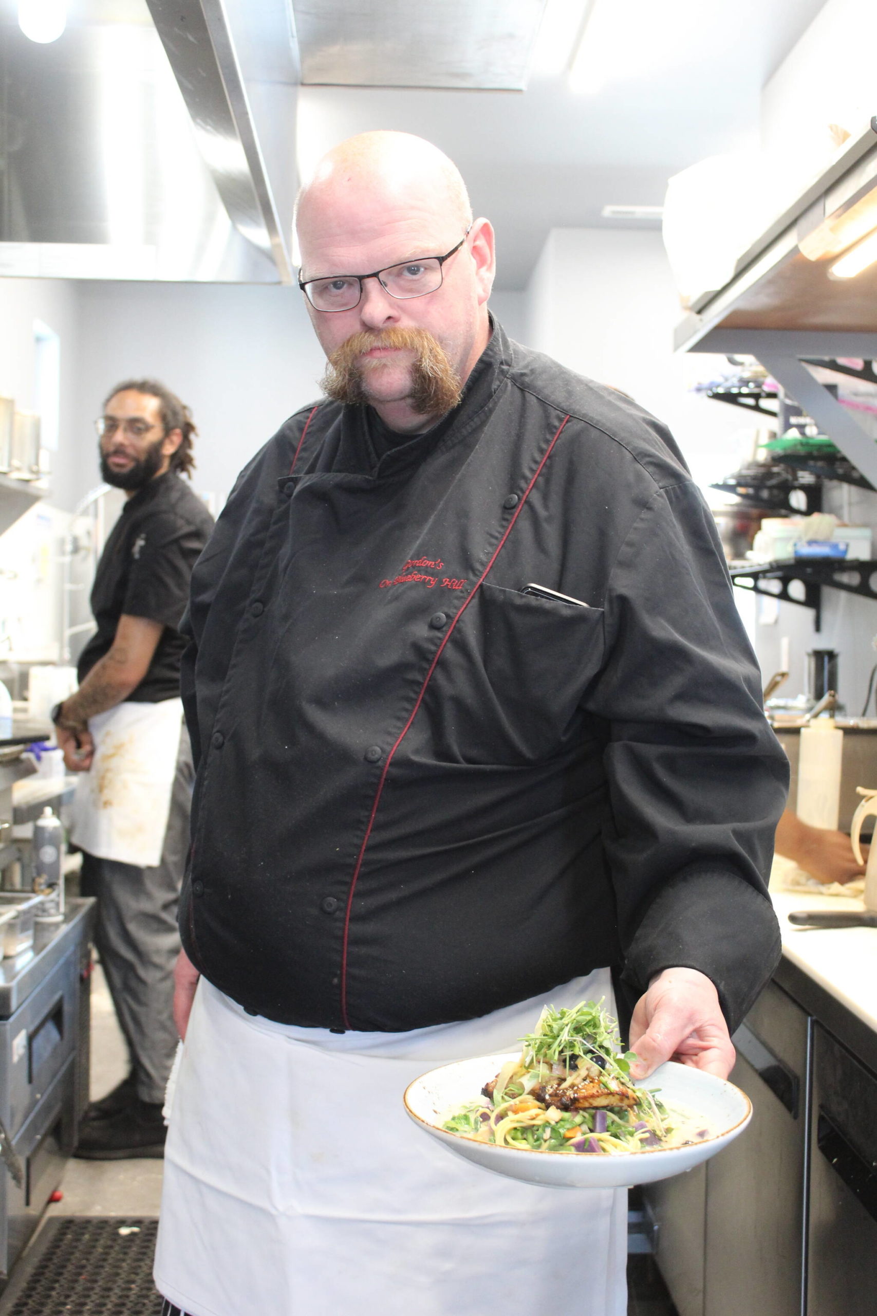 Gordon Stewart shows off one of the unique dishes from the Gordon’s Fusion menu. (Photo by Karina Andrew/Whidbey News-Times)