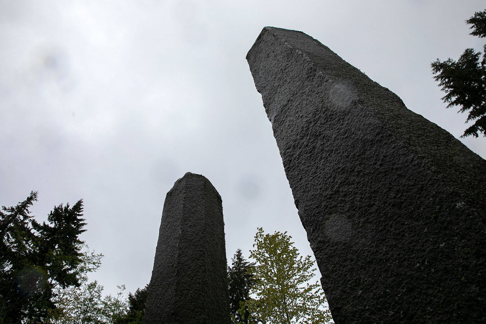 Two pillars of a stone circle tower over guests at Earth Sanctuary. (Ryan Berry / The Herald)