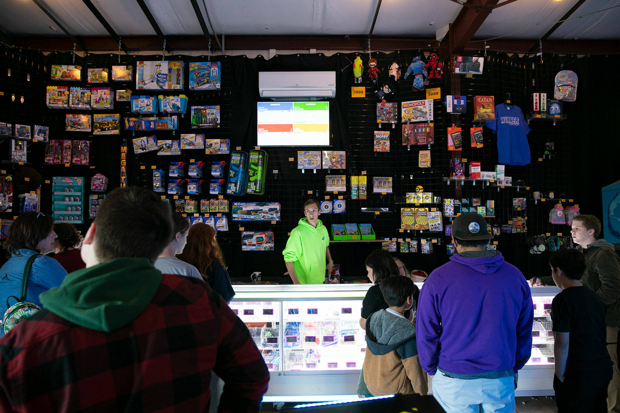 People line up to get their prizes at the arcade at the Blue Fox Drive-In Theater. (Ryan Berry / The Herald)