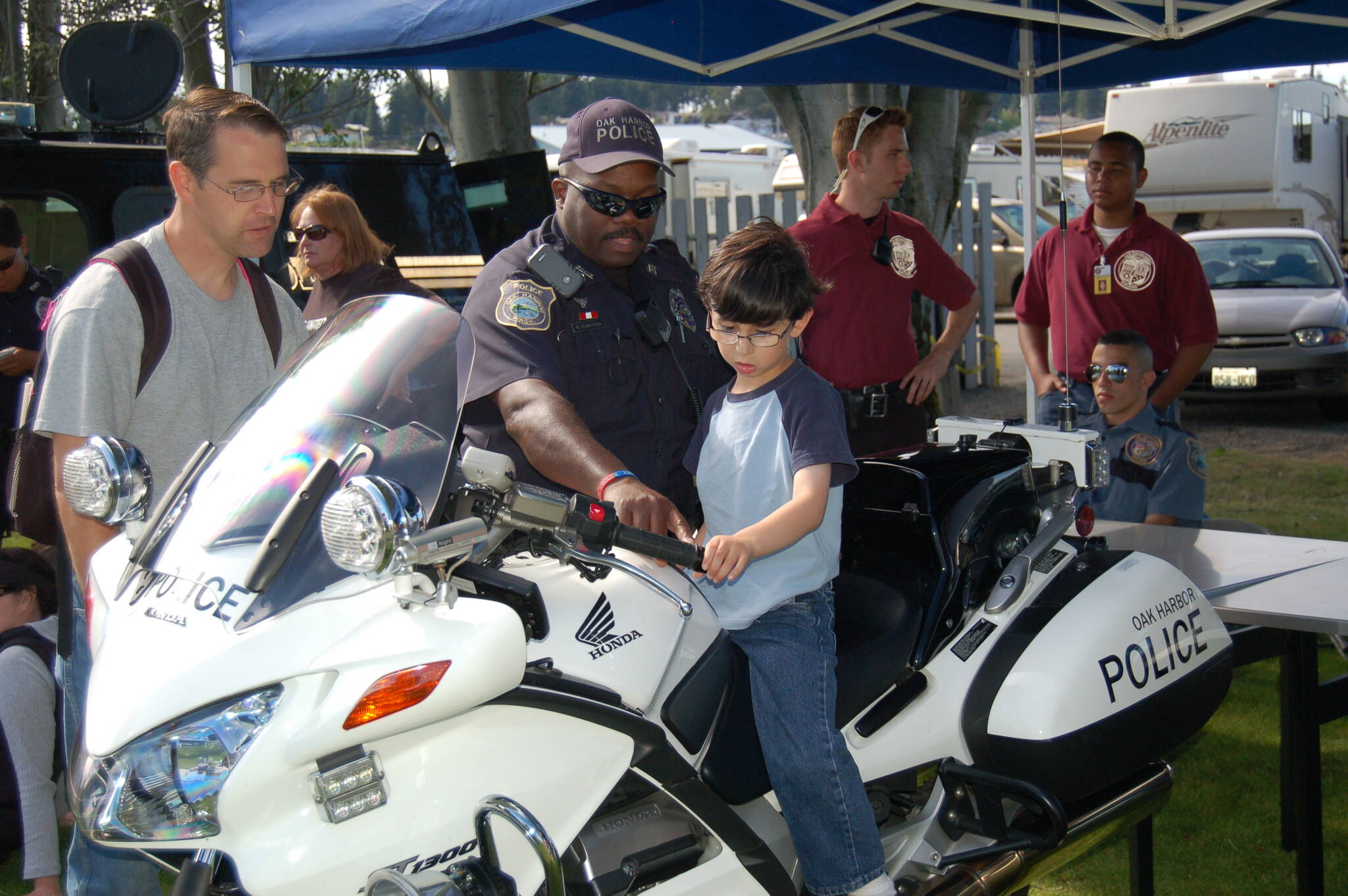 National Night Out has been happening in Oak Harbor for many years. A child gets to see a police motorcycle up close in this photo from 2011. (Photo provided by Oak Harbor Police Department)