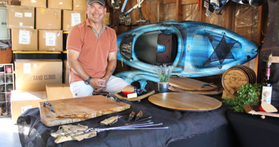 Bill Leuthe repurposes wine barrels to create serving trays, cutting boards and furniture. He will be selling his products at the Coupeville Arts and Crafts Festival for the first time this year. (Photo by Karina Andrew/Whidbey News-Times)