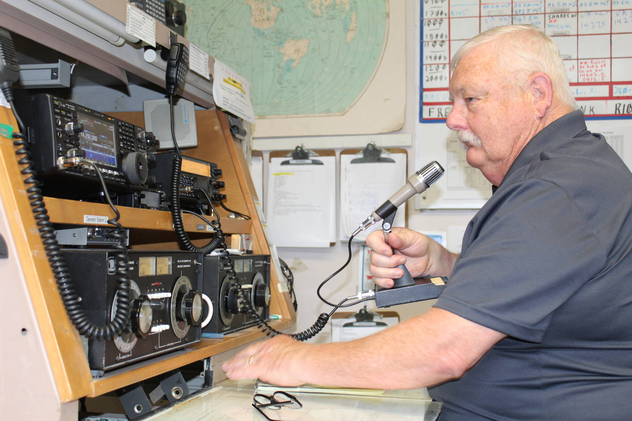 Terry Sparks uses the high-frequency radio at the NAS Whidbey Island Military Auxiliary Radio Service Station. (Photo by Karina Andrew/Whidbey News-Times)