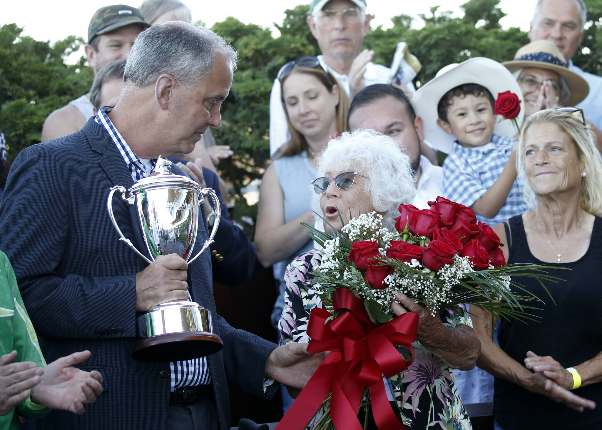 Darlyne Krieg receives the winning trophy at Longacres Mile. (Photo provided by Emerald Downs)