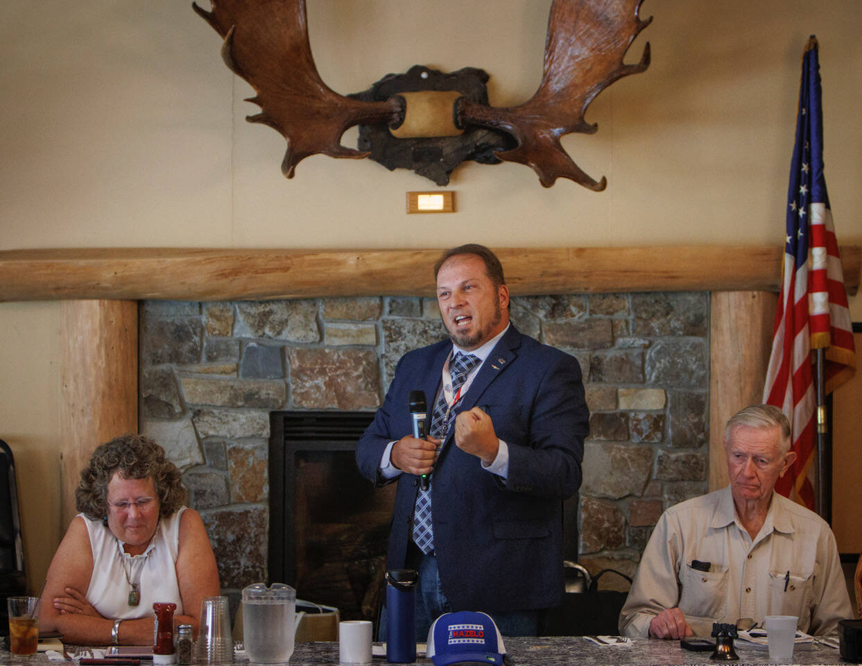 Photo by David Welton
Republican Tim Hazelo, a candidate for Island County commissioner, addresses attendees at a recent Old Goats  Fully Informed Voters luncheon. Left, Democrat and incumbent Janet St. Clair. Right, Rufus Rose, an organizer of the discussion group and moderator for the lunch event.