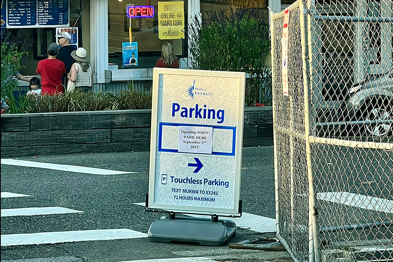 This Tuesday photo shows a sign by the Mukilteo waterfront parking lot that says the lot opens Sept. 2, however the lot’s opening has been delayed. (Andrea Brown / The Herald)