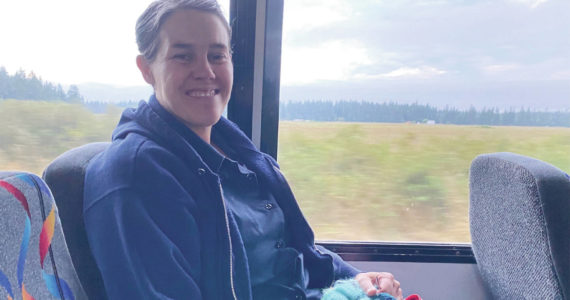 Michele knits and listens to music during her weekday Island Transit commute for her work with the Public Health Department.