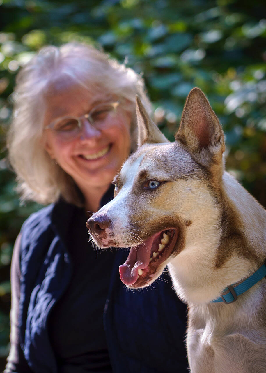 Photos by David Welton
Kathryn Hurtley sits with Trek. She read about his need for a home last February and has helped him develop into a friendly and trusting dog from the fearful feral dog he was last year.