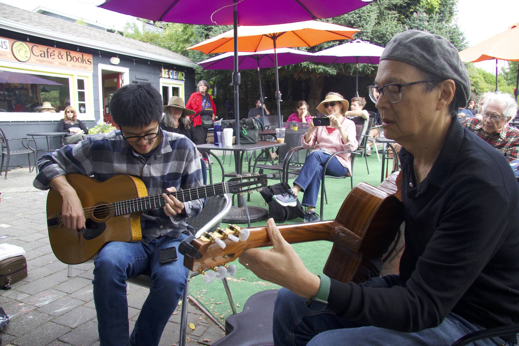 Photo by Rachel Rosen/Whidbey News-Times
Alex Lew, at left, and Jim Char of Pearl Django play in a jam session in Langley, a DjangoFest tradition.