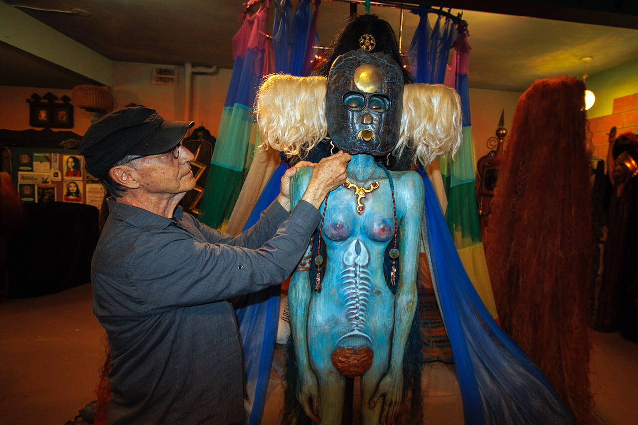 Jerry Wennstrom with “Water,” one of his sculptures representing the four elements.